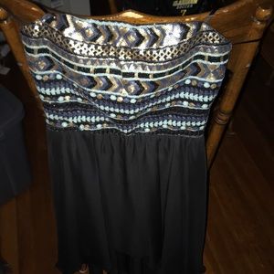 Strapless sequined dip hem dress